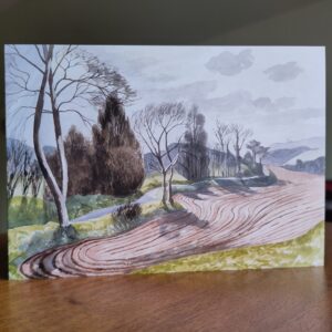 Christmas card with painting of a ploughed field in winter