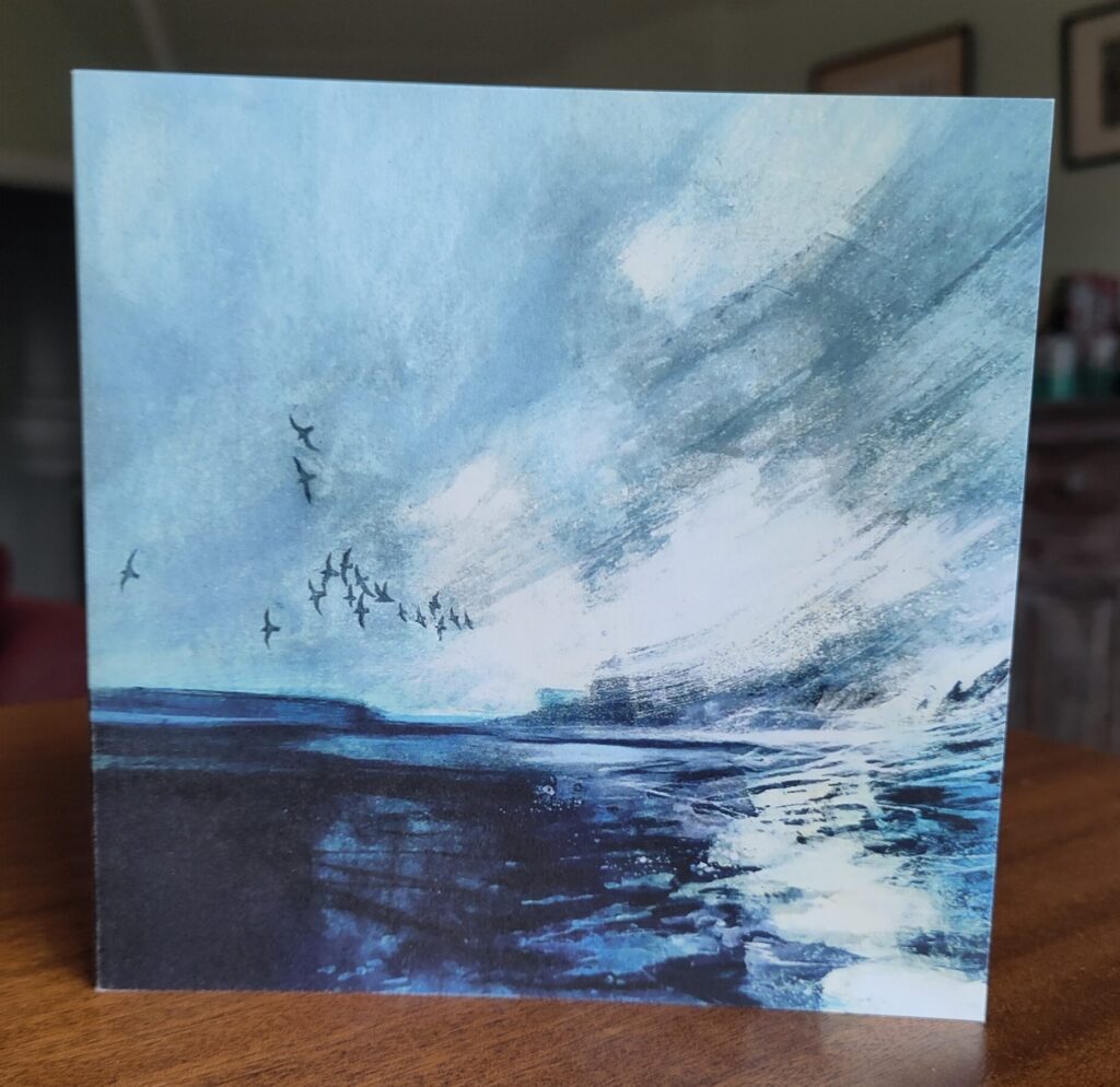 Greetings card with painting of a flock of birds flying over a stormy sea