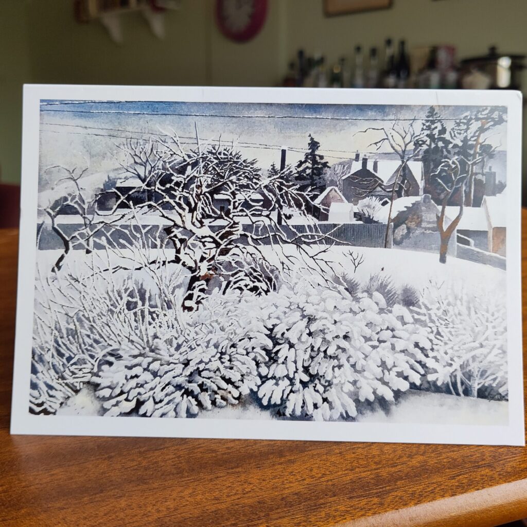 Christmas card with painting of trees and shrubs in snow